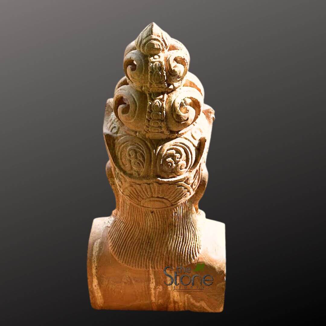 2ft Lord Vishnu Head 3 long, intricately carved sandstone sculpture is presented from a rear-facing, slightly angled perspective, set against a solid, dark gray to black gradient background that emphasizes its detail. The sculpture, rendered in a warm, earthy reddish-tan hue, appears to be the upper torso and head of a figure, likely a deity or royal personage, adorned with an elaborate, multi-tiered ceremonial headdress. At the very top, a prominent, pointed finial tapers elegantly upwards, reminiscent of a temple spire or a royal crown element. Below this spire, the headdress is composed of several distinct, stacked layers, each meticulously carved with deeply incised, swirling scrollwork, volutes, and stylized floral or geometric motifs. These intricate patterns create a rich sense of texture and depth, reflecting exceptional traditional craftsmanship. The details suggest a classical or ancient artistic style, possibly from an East Asian or Southeast Asian cultural context, such as Khmer or Indian art. The neck area, visible beneath the ornate headdress, features fine, parallel vertical grooves, which could represent textured hair, a finely pleated collar, or draped fabric. The broad, subtly rounded shoulders are visible at the base of the image, hinting at the full form of the statue. Strong, directional lighting from the upper left highlights the three-dimensional quality of the carvings, casting soft shadows that further emphasize the meticulous artistry and the aged, spiritual aesthetic of the piece. This detailed stone carving showcases skilled stonework and would be highly relevant for articles discussing ancient sculptures, traditional art forms, religious iconography, or the preservation of cultural heritage.