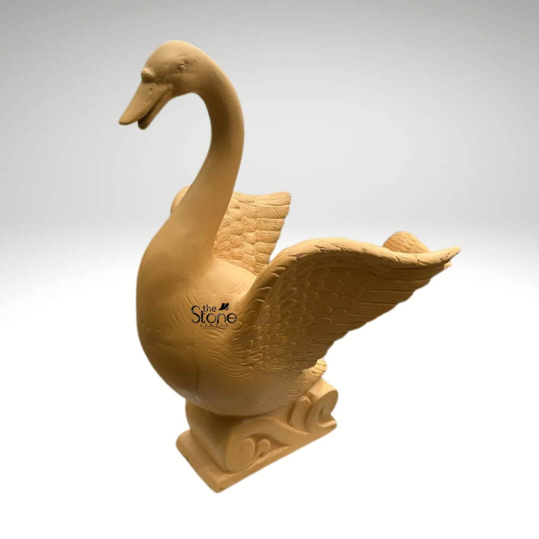 Garden Duck Fountain 2ft 4 An exquisite 2-foot tall swan-style duck fountain meticulously crafted from durable fibre material, perfect for enhancing landscape decor. This outdoor water feature showcases a majestic bird with an elegant, long arched neck and wide-spread wings, revealing intricate, rhythmic feather patterns etched into the surface. The fountain features a fibre finish, providing a natural aesthetics while remaining lightweight and weather-resistant. It stands on an artistic pedestal base adorned with swirling, wave-like relief carvings that emphasize its aquatic theme and connection to water. Designed as a serene focal point for garden ponds, backyards, or courtyards, this artistic sculpture invites tranquility and grace into any residential or commercial outdoor sanctuary, illustrating how modern fibre craftsmanship can blend seamlessly with natural outdoor elements.