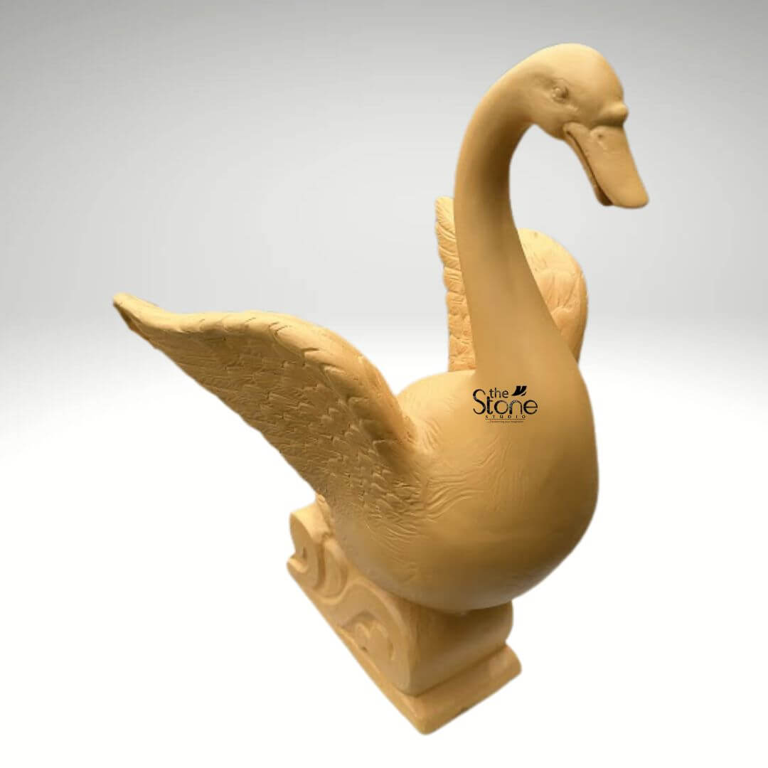 Garden Duck Fountain 2ft 5 An elegant 2-foot tall outdoor duck fountain statue designed for sophisticated garden and landscape decor. Expertly crafted from durable fibre material, this fibre water fountain depicts a majestic swan-style duck in a dynamic, poised posture. The sculpture features an elongated, arched neck and wide-spread wings that showcase intricate, rhythmic feather textures. The bird is mounted on an artistic pedestal base embellished with traditional wave-like relief carvings, emphasizing its aquatic theme. Its earthy tan hue and rustic matte finish provide a natural stone aesthetic while remaining lightweight and weather-resistant. This artistic centerpiece is ideal for creating a tranquil atmosphere in outdoor courtyards, pond areas, or lush backyards, blending modern craftsmanship with timeless organic forms to enhance a home’s exterior sanctuary.