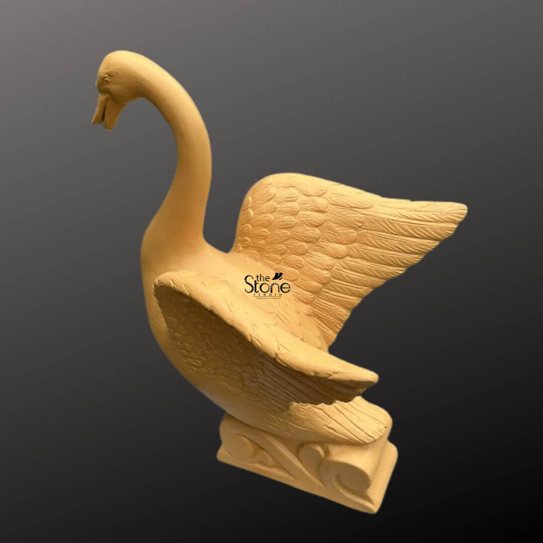 Garden Duck Fountain 2ft 6 An elegant 2-foot tall decorative duck fountain designed for sophisticated garden and landscape decor. Expertly crafted from durable fibre material, this fibre water fountain depicts a majestic swan-style bird in a dynamic, poised posture. The sculpture, shown from a three-quarter side angle, features an elongated, arched neck and wide-spread wings that showcase intricate, rhythmic feather textures etched into the surface. The bird is mounted on an artistic pedestal base embellished with traditional wave-like relief carvings, emphasizing its aquatic theme and connection to water features. Its warm earthy tan hue and rustic matte finish provide a natural stone aesthetic while remaining lightweight and weather-resistant. This artistic centerpiece is ideal for creating a tranquil atmosphere in outdoor courtyards, pond areas, or lush backyards, blending modern craftsmanship with timeless organic forms to enhance a home’s exterior sanctuary.