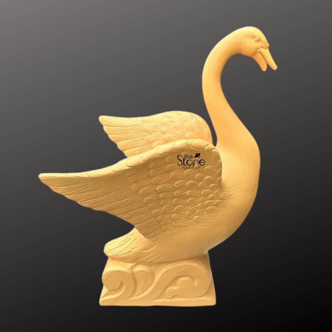 Garden Duck Fountain 2ft 1 An elegant 2-foot tall fibre duck fountain designed for sophisticated garden and landscape decor. Expertly crafted from durable, lightweight fibre material, this sculpture depicts a majestic swan-style bird in a dynamic, poised posture. The fountain features an elongated, arched neck and wide-spread wings that showcase intricate, rhythmic feather textures etched into the surface. The bird is mounted on an artistic pedestal base embellished with traditional wave-like relief carvings, emphasizing its aquatic theme and connection to outdoor water features. Its earthy tan hue and rustic matte finish provide a natural stone aesthetic while remaining weather-resistant and easy to maintain. This artistic centerpiece is ideal for creating a tranquil atmosphere in outdoor courtyards, pond areas, or lush backyards, blending modern craftsmanship with timeless organic forms to enhance a home’s exterior sanctuary.