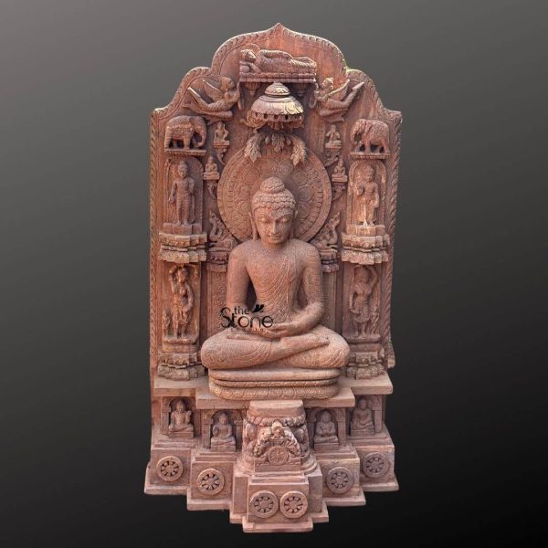 A magnificent 4-foot tall Lord Buddha meditation statue, masterfully hand-carved from natural brown sandstone, serves as a profound spiritual centerpiece. The large-scale sculpture depicts the Buddha in a serene seated meditative posture, his hands resting in the Dhyana Mudra atop an intricately detailed, multi-tiered pedestal. The central figure is framed by an exceptionally elaborate stone stele or back panel, rich with symbolic Vedic and Buddhist iconography. At the peak of the panel lies a smaller reclining Buddha representing Mahaparinirvana, flanked by celestial beings and guardian elephants. The sides of the panel are adorned with multiple standing figures of monks and deities in high relief, while a beautifully carved circular halo (Prabhavali) surrounds the Buddha’s head. The sturdy base of the 4 feet brown sandstone statue features several smaller seated Buddhas in recessed niches and a row of Dharma wheels (Chakras) at the bottom, symbolizing the path to enlightenment. The grainy, earthy texture and warm tones of the sandstone give the piece a timeless, antique temple aesthetic. This large stone Buddha meditation statue is ideal for grand home gardens, temple courtyards, or large meditation sanctuaries, inviting an atmosphere of deep peace and spiritual protection.