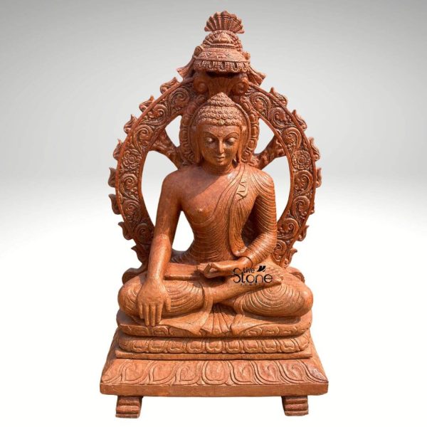 An intricately hand-carved 3.5-foot tall sitting Buddha statue crafted from premium natural brown sandstone, depicted in a serene and grounded meditative pose. This sandstone Buddha sculpture features the deity in the iconic Bhumisparsha Mudra (earth-touching gesture), seated in a traditional cross-legged Padmasana (lotus position). The central figure is magnificently framed by a grand and highly detailed decorative arch (Prabhavali) that showcases masterful relief carvings of rhythmic floral and flame-like motifs. At the peak of the ornate arch sits a multi-tiered stone chhatri (canopy), representing divine protection and spiritual sovereignty. The Buddha's facial expression is one of profound peace, with downcast eyes and a subtle smile, complemented by finely detailed curls and elongated earlobes. The sculpture rests on a sturdy, multi-tiered rectangular pedestal adorned with elegant lotus petal carvings and supported by four small base legs. The warm, earthy reddish-brown tones and rustic texture of the sandstone provide a timeless, antique aesthetic. This large sitting Buddha statue with a decorative arch is an ideal spiritual centerpiece for a home mandir, garden landscape, or Zen meditation corner, designed to invite an aura of stability, mindfulness, and tranquility into the environment.