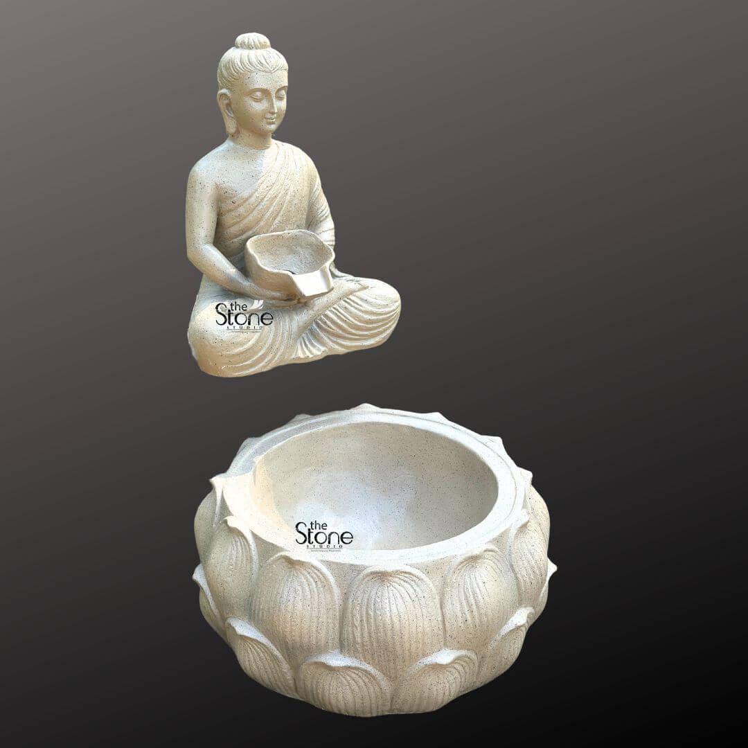 Wall-Mounted Buddha Fountain 3ft 4 A serene wall-mounted Buddha fountain crafted from fiber with a light textured finish is elegantly presented against a dark minimalist background emphasizing its peaceful aesthetic and suitability for indoor spaces. The fountain features a tranquil Buddha figure sculpted from light-colored fiber to resemble weathered stone seated in the lotus position. The Buddha's hands are gently positioned in his lap holding a small shallow bowl from which water is designed to flow. His eyes are downcast conveying a profound sense of meditation inner peace and spiritual contemplation making it an ideal focal point for an indoor calming environment. The Buddha statue is depicted with smooth flowing robes draped gracefully over his body with naturalistic folds that add depth and realism to the lightweight fiber material. His facial features are serene and finely sculpted, featuring a ushnisha on his head symbolizing wisdom and enlightenment and elongated earlobes indicative of his renunciation of worldly possessions. The light neutral color of the fiber lends the statue a timeless and versatile appeal perfectly blending with various indoor decor styles, from modern to traditional. Positioned directly beneath the Buddha figure and appearing as if mounted on the same wall plane, is a large intricately carved lotus-shaped basin. This basin matching the light-colored, textured finish of the Buddha features multiple layers of detailed lotus petals symbolizing purity spiritual awakening and beauty. The design clearly indicates that water would gently cascade from the Buddha's bowl into this larger aesthetically pleasing basin, creating a soothing sound and visual effect that is ideal for indoor tranquility. This fiber Buddha fountain is an exquisite piece for creating a calming and meditative atmosphere within a home, office or spiritual room as highlighted in an article discussing wall-mounted Buddha fountains for indoors.