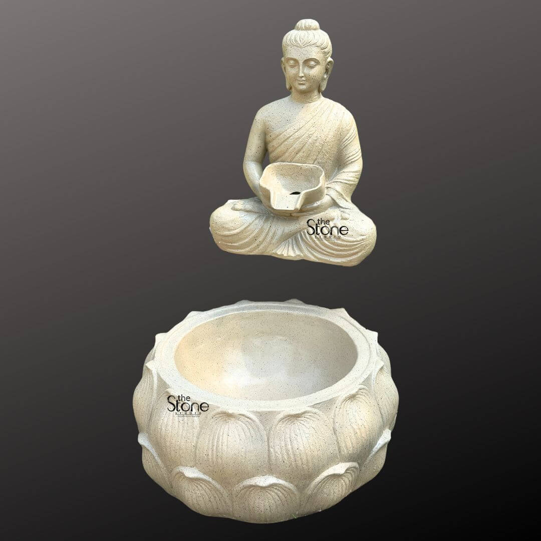 Wall-Mounted Buddha Fountain 3ft 7 A serene wall-mounted Buddha fountain expertly crafted from fiber with a textured light gray finish is elegantly presented against a dark minimalist background. This two-part fountain system features a tranquil Buddha figure and a separate lotus-shaped basin both designed to be affixed to a wall to create a harmonious and continuous water flow. The Buddha figure sculpted from lightweight fiber to resemble natural weathered stone is depicted seated in the traditional lotus position emanating a profound sense of peace and meditation. His hands are gently positioned in his lap holding a small shallow bowl with a distinct spout from which water is designed to gracefully cascade. The Buddha's eyes are softly downcast conveying a deep state of inner calm and spiritual contemplation making him an ideal focal point for any tranquil environment. The Buddha statue is depicted with smooth flowing robes draped elegantly over his body with visible naturalistic folds that add depth and realism to the fiber material. His facial features are finely rendered and serene featuring a prominent ushnisha on his head symbolizing wisdom and enlightenment and elongated earlobes indicative of his renunciation of worldly possessions. The light neutral color of the fiber subtly speckled with darker flecks mimics the appearance of natural stone lending the statue a timeless and versatile appeal suitable for a wide range of indoor or outdoor decor styles. Positioned directly beneath the Buddha figure and designed to align perfectly for water collection, is a large intricately carved lotus-shaped basin. This basin, matching the light-colored textured finish of the Buddha features multiple layers of detailed lotus petals symbolizing purity spiritual awakening and beauty. The design clearly indicates that water would gently cascade from the Buddha's spouted bowl into this larger aesthetically pleasing basin creating a soothing sound and visual effect that is ideal for fostering a calm and meditative atmosphere. This wall-mounted fiber Buddha fountain is an exquisite choice for creating a tranquil and spiritual focal point in a home garden, or any space where serenity is desired, as highlighted in an article discussing wall-mounted fiber Buddha fountains.