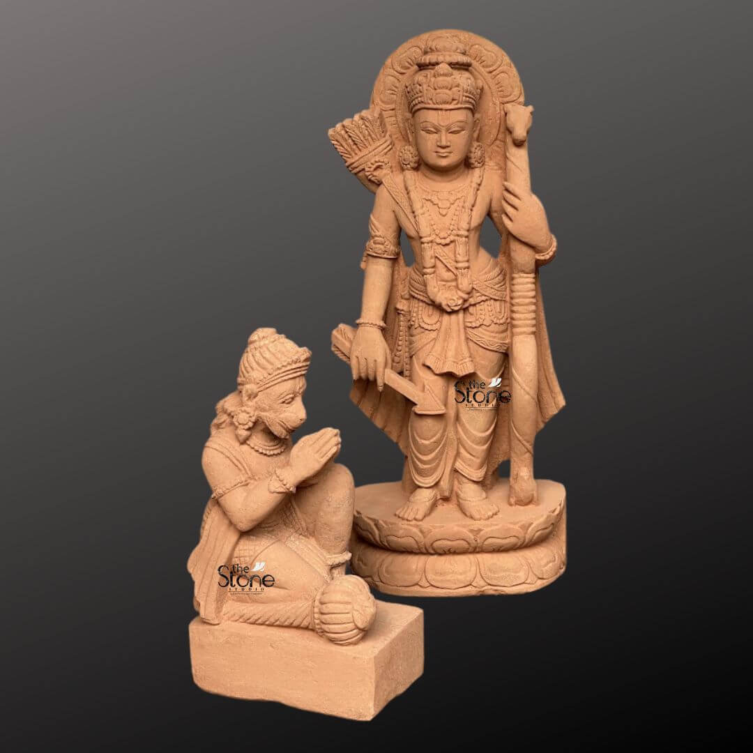 Ram Darbar Idol for Home Temple 2ft 9 A beautifully sculpted 2-foot sandstone statue of Lord Rama accompanied by a kneeling Hanuman is elegantly displayed against a dark gradient background. This image is part of a larger Ram Darbar set, representing the divine assembly of Ram Sita Lakshman, and Hanuman. Lord Rama stands prominently holding his bow and a quiver of arrows embodying righteousness and valor. He is adorned with an elaborate crown intricate jewelry and flowing traditional garments all meticulously carved from the warm earthy sandstone. Behind his head a circular halo-like structure is intricately carved with traditional patterns further accentuating his divine aura. The craftsmanship is evident in every detail from the serene expression on Lord Rama's face to the delicate folds of his attire and the intricate patterns of his ornaments. The sandstone's natural texture and warm hue give the statue an authentic ancient feel enriching its spiritual presence and highlighting the artisans' skill. The standing figure of Rama rests on a multi-layered circular base featuring delicate lotus petal motifs, providing both stability and aesthetic appeal. In the foreground, kneeling respectfully to Lord Rama's right, is Hanuman carved in a posture of profound devotion with his hands clasped in reverence. Hanuman also sports a crown and subtle adornments signifying his importance and loyalty. This pairing of Lord Rama with his devoted follower Hanuman as part of a 2-foot sandstone Ram Darbar statue captures a powerful narrative of divine heroism and unwavering service, making it a compelling subject for an article exploring such revered sculptures.