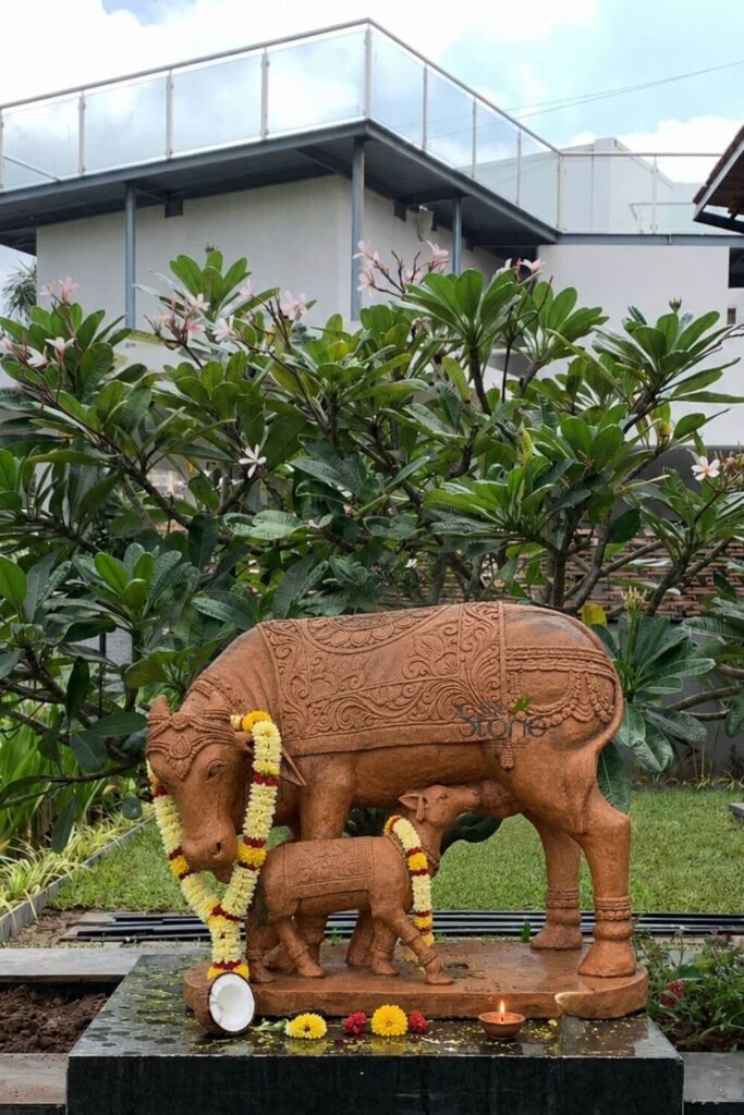 Best Sculpture Gifts for a Housewarming Ceremony 21 Kamdhenu with cow statue gift for housewarming ceremony