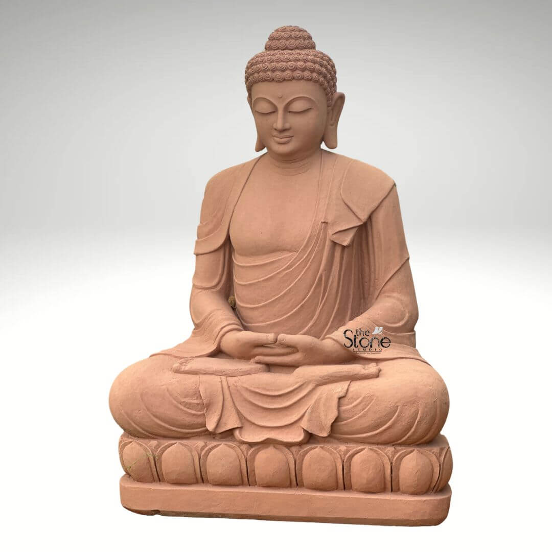 5 Feet Sandstone Buddha Statue for Garden 5 A magnificent 5-foot large sandstone Buddha statue, prominently featured against a neutral background, designed for outdoor spaces as highlighted in the accompanying article. The entire statue is meticulously carved from natural reddish-brown sandstone, giving it an earthy, warm, and timeless appearance that harmonizes beautifully with natural environments. The Buddha is depicted seated in the full lotus position (Padmasana), with both hands gently resting in his lap, palms facing upwards, in the Dhyana Mudra (meditation gesture), symbolizing deep contemplation, inner peace, and spiritual awakening. The robes are elegantly draped over his left shoulder, with realistic, flowing folds and pleats meticulously carved into the sandstone. These details convey a sense of serenity and the soft texture of fabric, adding depth to the sculpture. The Buddha's face is characterized by a profoundly calm and contemplative expression, with downcast, half-closed eyes, a gentle nose, and subtle lips, embodying a state of complete enlightenment and inner stillness. His tightly curled hair (ushnisha), a distinctive iconographic feature, is intricately textured, and his elongated earlobes are visible, symbolizing wisdom and a royal past. The Buddha is seated on a beautifully carved lotus pedestal, also made of sandstone, with individual lotus petals clearly defined, symbolizing purity and spiritual growth. The smooth contours and fine details throughout the entire 5-foot statue emphasize a deep sense of tranquility and spiritual harmony. This large sandstone Buddha statue is a powerful and durable representation of peace and reflection, making it an ideal choice for enhancing the aesthetic and spiritual ambiance of any outdoor space, such as gardens, courtyards, or meditative areas, perfectly aligning with the article's focus on its suitability for open-air environments.