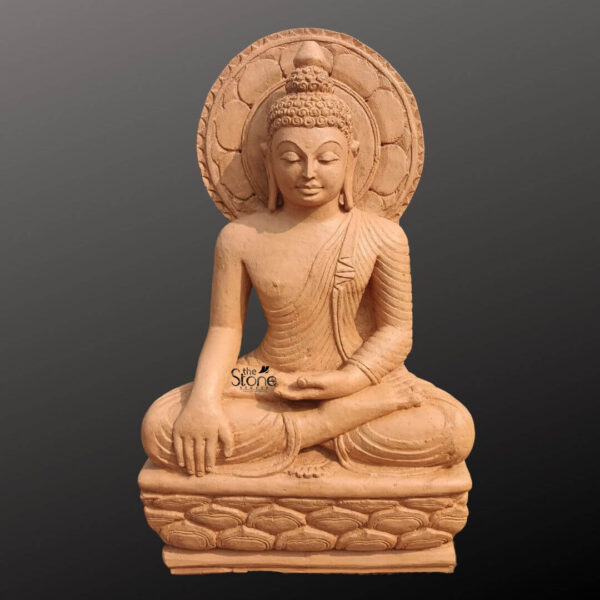A full eye-level photograph capturing a magnificent Meditating Buddha Sandstone Statue standing approximately 2.5 feet tall and hand-carved from a single block of warm brown sandstone. The statue is depicted in a traditional seated posture with the left hand resting in the lap and the right hand touching the earth symbolizing the moment of his enlightenment. The natural grain and warm earthy tones of the sandstone are clearly visible highlighting the artisan's skillful carving on the robe's folds facial features and the ushnisha. The Buddha is seated upon an intricately carved multi-tiered pedestal also made of matching brown sandstone which features a decorative lotus petal motif around the base. His face is serene and composed with downcast eyes conveying a sense of deep meditation and tranquility along with a gentle benevolent smile. The statue's form is sculpted with careful attention to anatomical detail and proportion reflecting the rich tradition of Indian stone carving. A large perfectly circular halo featuring an ornate carved border rises from behind the Buddha's head further accentuating his divine form. This commanding 2.5ft sandstone statue embodies the spiritual essence and iconographic details of the enlightened one making it a suitable and sacred focal point for a home altar garden shrine or meditation space. The careful carving of every element from the tassels of his garments to the petals of the lotus throne reflects centuries-old sculpting techniques. The overall composition conveys a profound sense of peace and spiritual connection making this Meditating Buddha Sandstone Statue a significant and beautiful example of traditional Indian sculpture. The photograph captures the statue against a plain dark grey studio background emphasizing the detailed craftsmanship and the natural beauty of the sandstone.